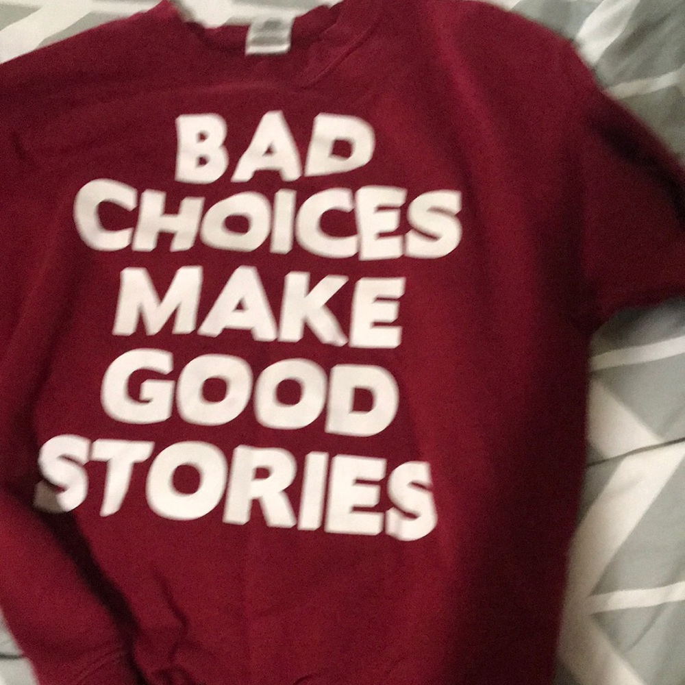 Red “Bad choices make good stories” crew neck sweater